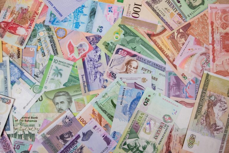 different bills on the table. Money background. Banknotes from different countries of the world.