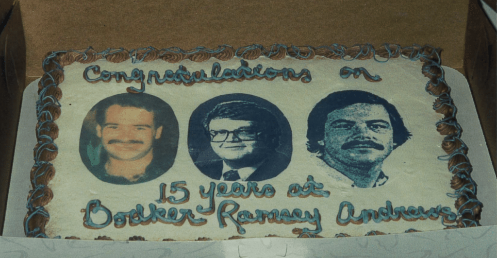 Cake from the 15th anniversary party featuring photos of Brian Bodker, Tim Ramsey, and Steve Andrews (l-r)