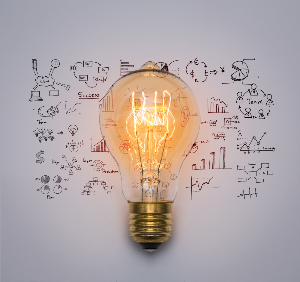 A lit light bulb is centered over sketches of business charts, graphs, and diagrams on a white background, symbolizing innovation and creative ideas in business planning.
